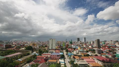 Clouds float over a large city