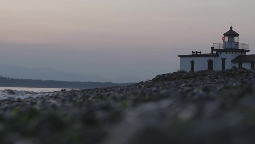 A scenery of a light house near beach