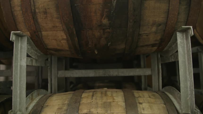 A stack of wine (or alcohol) barrels in closeup