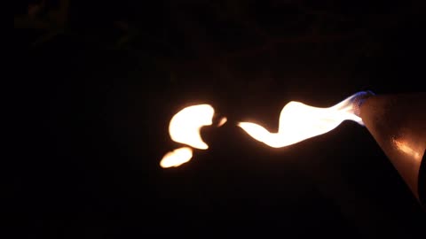 A flame coming out of a torch lamp