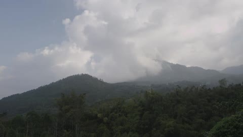 Clouds float over a mountain