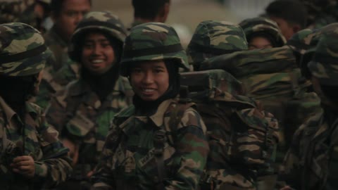 Soldiers smile and laugh