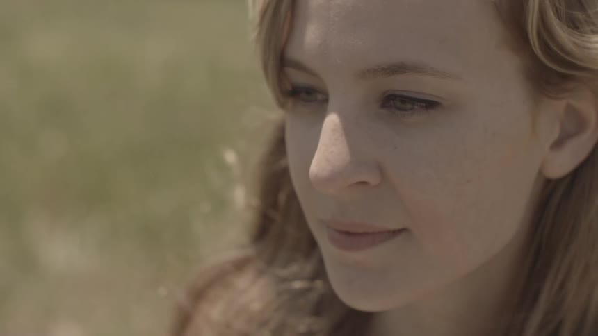 A person's hair blowing in the wind