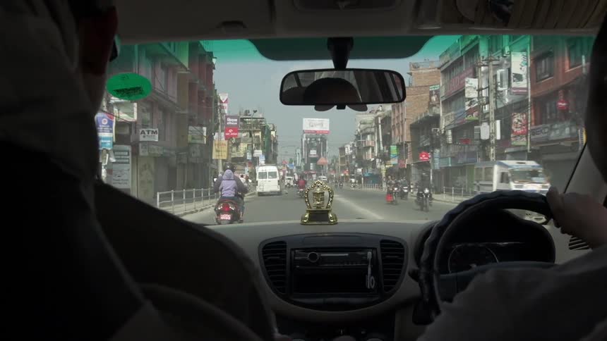 View of city traffic from inside a vehicle