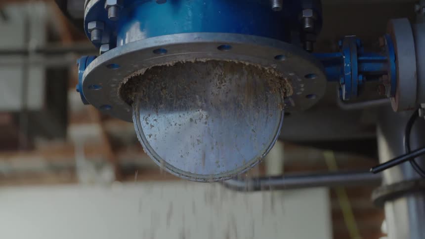 Material dumps out of machinery