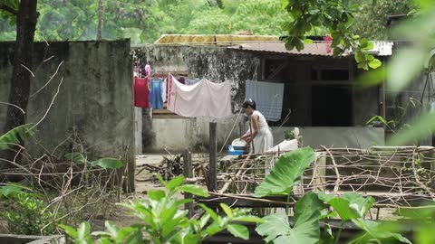 A person hanging up laundry