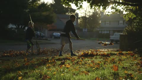 Children are raking leaves
