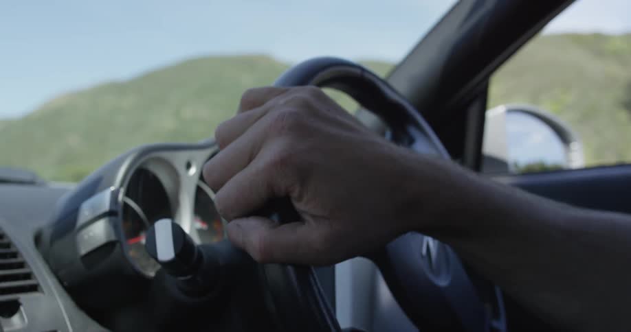 A person wearing a helmet in a car