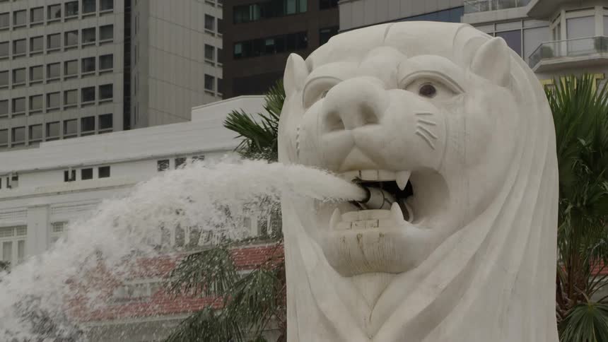 Water spouts from the mouth of a lion fountain
