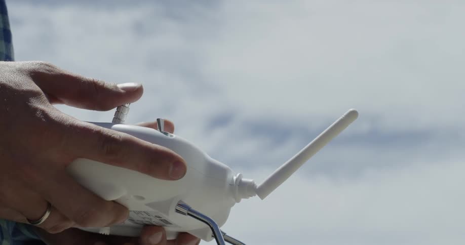 A person holding a remote control
