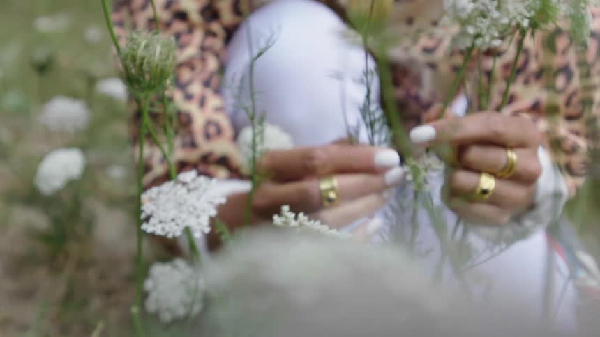 A woman picking flowers