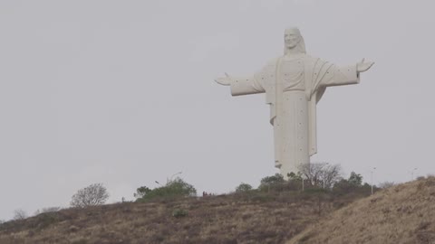 A statue on top of a hill