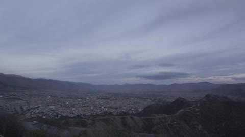 Clouds float over a valley