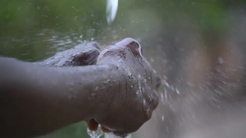 A person washing their hands