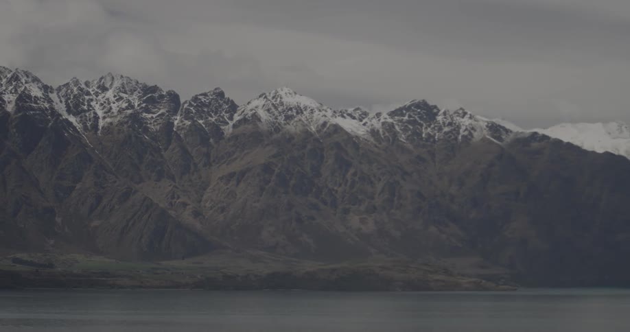 Snow-topped mountains loom in the distance