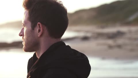 A person looking  out at the ocean