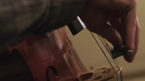 Close up of person playing a cello