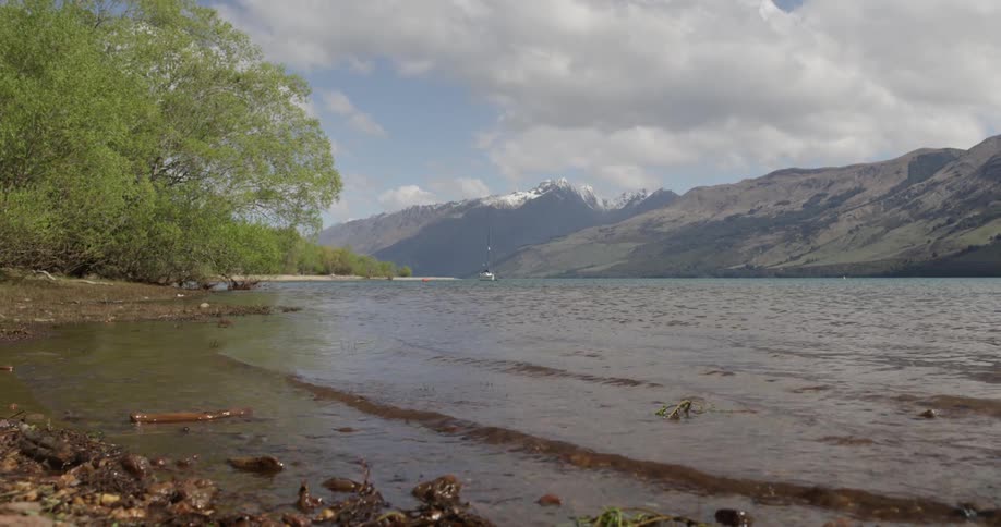 Small wave ripples on a lake shore