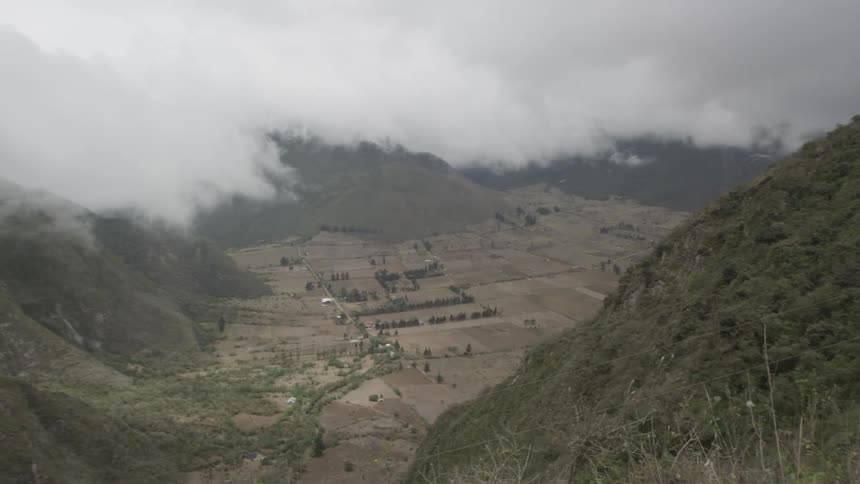 A cloudy hillside valley