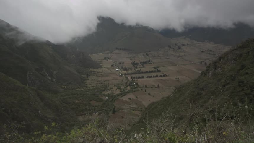 A cloudy hillside valley