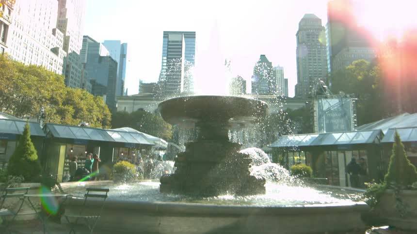 A fountain stands in the center of a city