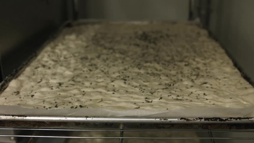 Dough bakes inside an oven