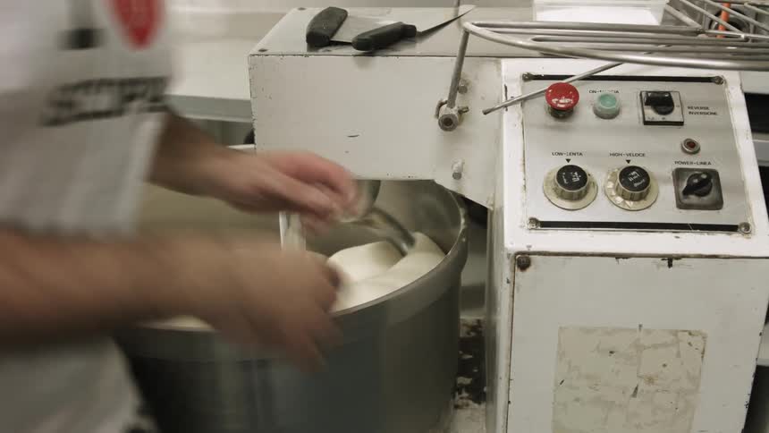 Person working a kneading machine