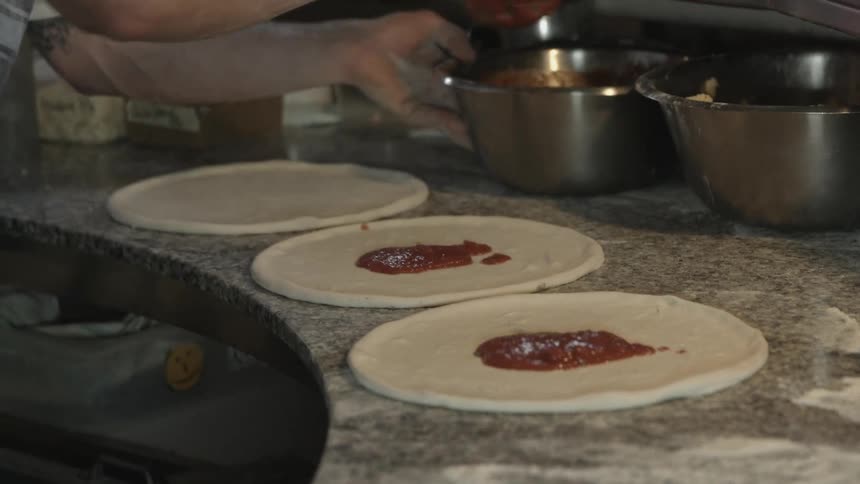 A man preparing foods at the kitchen