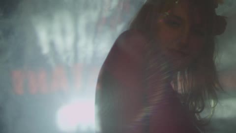 A smoky room with a person in it