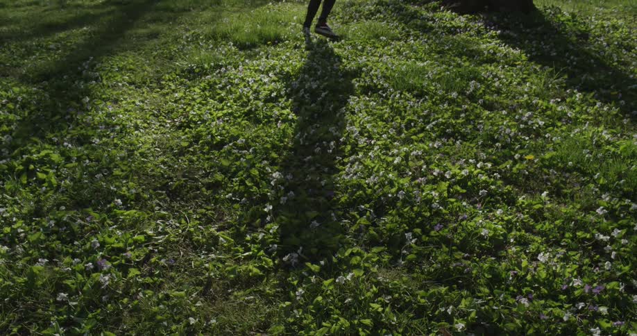 A person walking on grass
