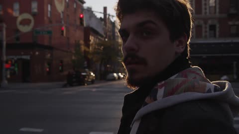 A person standing on a street corner