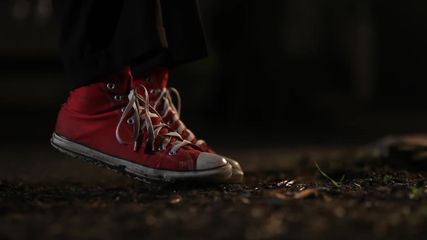 Person in red sneakers elevating into the air