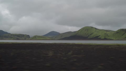View of a lake from a rapidly moving vehicle