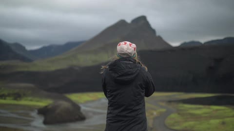 A person taking pictures of nature