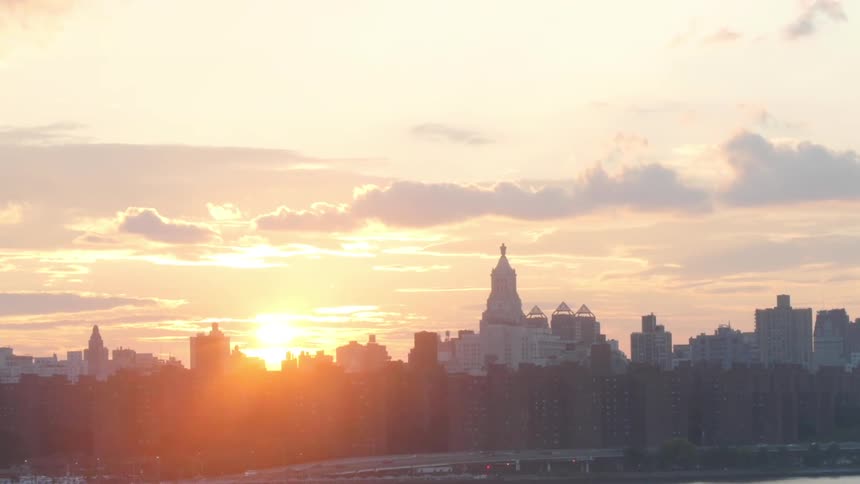 A scenery of a city skyline at dawn