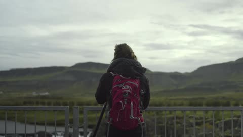 A person taking pictures of nature