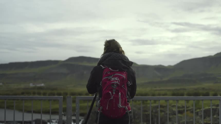 A person taking pictures of nature