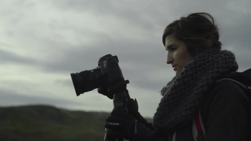 A person taking pictures of nature