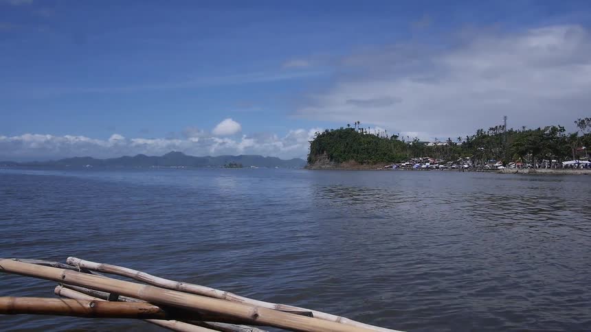 A boat travels on the ocean