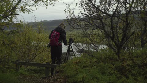 A person taking pictures of nature