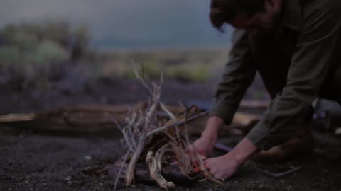 A person making a fire