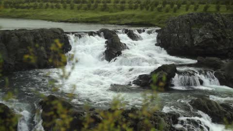 Water cascades down a waterfall
