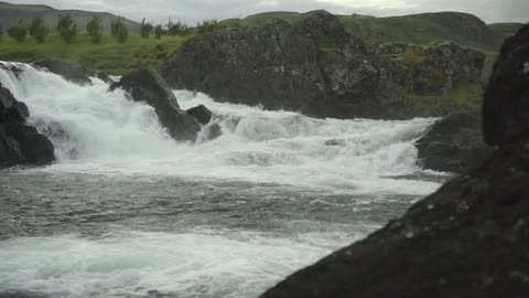 Water rushing over rocks in a rushing river
