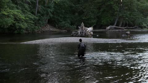 A person crossing a river