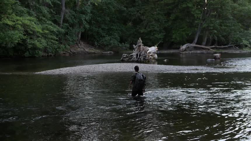 A person crossing a river