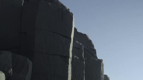 A rocky jagged cliff side