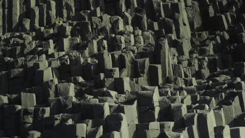 A rocky jagged cliff side