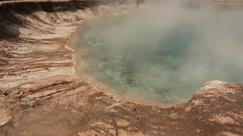 Bubbling and steaming waters of a hot spring