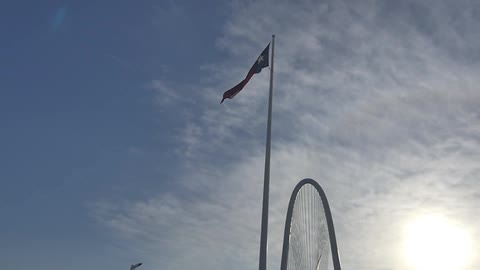 A flag is shown near a bridge