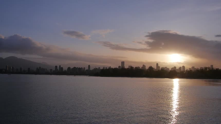The sun sets over a lake